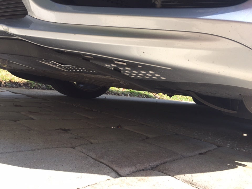 How do I reattach this front trim piece under bumper?