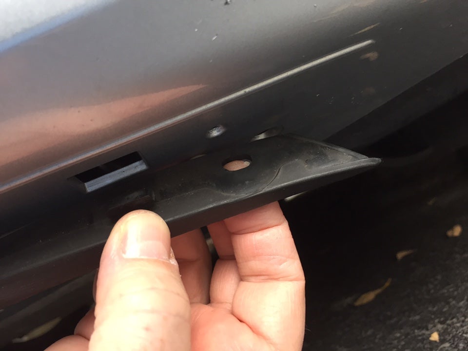 How do I reattach this front trim piece under bumper?